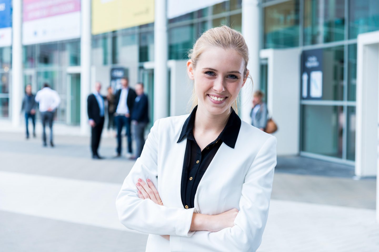 young business woman at a trade fair entrance